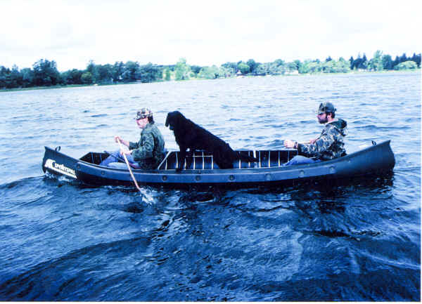 Sportspal Model S-16 Canoe with a hunting dog